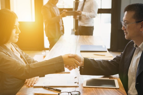 Business handshake symbolizing a successful M&A 